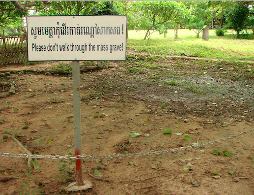 Sign reads Please dont walk through the mass grave! Source: Wikimedia Commons